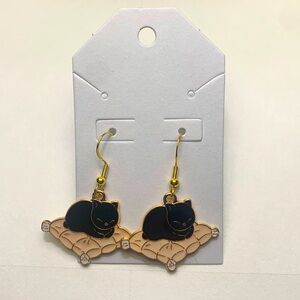 Black and beige sleepy cat earrings